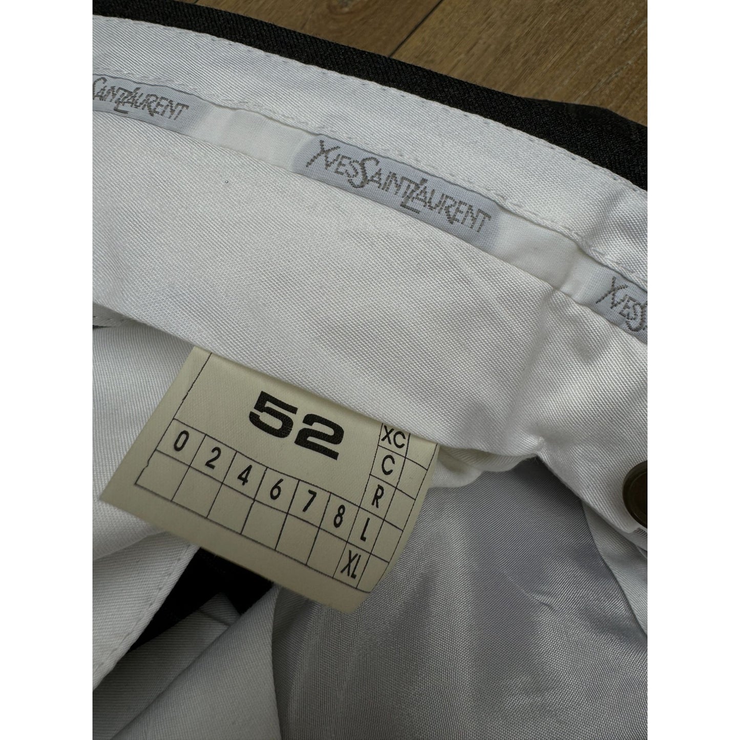 Yves Saint Laurent x Loro Piana
Dark Grey Pinstripe Wool Suit Size EU 52 / US 42R